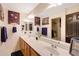 Bathroom featuring a double vanity, and modern lighting fixtures at 4138 N 298Th Ln, Buckeye, AZ 85396