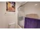 Bathroom featuring a glass shower, with painting, toilet and neutral wall colors at 4138 N 298Th Ln, Buckeye, AZ 85396