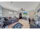 A bright bedroom with a ceiling fan, window, game decor, and a desk at 4138 N 298Th Ln, Buckeye, AZ 85396