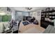 Bedroom with a ceiling fan, game decor, two windows, and a desk at 4138 N 298Th Ln, Buckeye, AZ 85396