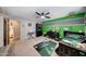 This bedroom has a ceiling fan, race car decor, and a desk at 4138 N 298Th Ln, Buckeye, AZ 85396