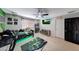 A stylish bedroom with ceiling fan, TV, decor, and a race car theme at 4138 N 298Th Ln, Buckeye, AZ 85396