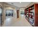 Open-concept foyer with tile flooring, a built-in bookcase, and arched entryways to other rooms at 4138 N 298Th Ln, Buckeye, AZ 85396