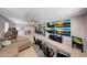 Open game room with comfortable seating, large TV setup, a carpeted floor and arcade games at 4138 N 298Th Ln, Buckeye, AZ 85396