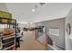 Bright game room showcasing carpeted floors, a game arcade, and a view to the lower level with iron railing at 4138 N 298Th Ln, Buckeye, AZ 85396