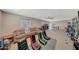 Large game room featuring a comfortable seating area, arcade games, and plenty of room for recreation at 4138 N 298Th Ln, Buckeye, AZ 85396