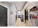 Hallway leading to a well-organized walk-in pantry with abundant shelving and storage at 4138 N 298Th Ln, Buckeye, AZ 85396