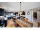 Well-appointed kitchen with dark cabinets, stainless steel appliances, an island and dining area at 4138 N 298Th Ln, Buckeye, AZ 85396