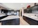 Spacious kitchen with an expansive island, abundant cabinetry, and stainless steel appliances at 4138 N 298Th Ln, Buckeye, AZ 85396