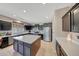 Bright kitchen boasts an island, stainless steel appliances, and generous counter space at 4138 N 298Th Ln, Buckeye, AZ 85396