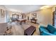 Expansive living room featuring a pool table, hardwood floors, and tasteful decor at 4138 N 298Th Ln, Buckeye, AZ 85396