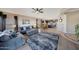 Open concept living room and kitchen area with modern appliances and stylish furnishings at 4138 N 298Th Ln, Buckeye, AZ 85396