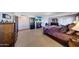 Spacious main bedroom boasts neutral carpeting, a fireplace, and a mounted television at 4138 N 298Th Ln, Buckeye, AZ 85396