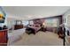 A luxurious main bedroom with a TV, a large bed, and ample space at 4138 N 298Th Ln, Buckeye, AZ 85396