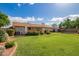 Lush backyard with green lawn, mature landscaping and cozy patio at 4232 W Purdue Ave, Phoenix, AZ 85051
