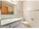 Functional bathroom featuring a classic vanity, toilet, and essential fixtures at 4232 W Purdue Ave, Phoenix, AZ 85051