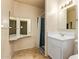 Cozy bathroom with a vanity and tiled shower at 4232 W Purdue Ave, Phoenix, AZ 85051