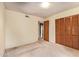 Inviting bedroom featuring plush carpeting, a large closet, and easy access to hallway at 4232 W Purdue Ave, Phoenix, AZ 85051