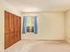 Cozy bedroom with a window, carpet, and closet space at 4232 W Purdue Ave, Phoenix, AZ 85051