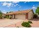 Well-maintained single-story home featuring desert landscaping, a spacious driveway, and a large two-car garage at 4232 W Purdue Ave, Phoenix, AZ 85051