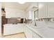 Bright kitchen with white cabinets and counters offering ample space at 4232 W Purdue Ave, Phoenix, AZ 85051