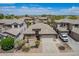 Aerial view of a single-Gathering home with desert landscaping, a two-car garage, and a tile roof at 43828 W Roth Rd, Maricopa, AZ 85138