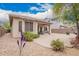 Well-maintained backyard featuring a covered patio and multiple seating options, complete with desert landscaping at 43828 W Roth Rd, Maricopa, AZ 85138