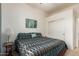Cozy bedroom featuring a ceiling fan and a closet with sliding doors at 43828 W Roth Rd, Maricopa, AZ 85138