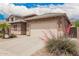 Inviting single-Gathering home with a two-car garage and vibrant front yard landscaping at 43828 W Roth Rd, Maricopa, AZ 85138