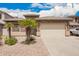 Well-maintained house showcasing a two-car garage, stone accents, and a landscaped front yard at 43828 W Roth Rd, Maricopa, AZ 85138