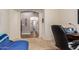 Home office featuring a desk and chair and leading into the hallway at 43828 W Roth Rd, Maricopa, AZ 85138