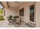 Covered patio featuring neutral tones, a ceiling light, and an outdoor dining set with four chairs at 43828 W Roth Rd, Maricopa, AZ 85138