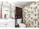 Traditional bathroom featuring a shower-tub, cabinet and sink at 4402 N 79Th Dr, Phoenix, AZ 85033