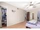 Bright bedroom boasts ceiling fan, laminate floors, and convenient en-suite bathroom access at 4402 N 79Th Dr, Phoenix, AZ 85033