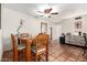 Comfortable dining room with decorative mirror and adjacent to kitchen at 4402 N 79Th Dr, Phoenix, AZ 85033