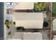 Aerial view of the home's roof, the backyard with a trampoline, and a putting green at 44355 W Oster Dr, Maricopa, AZ 85138
