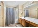 This bathroom boasts a shower-tub combo and a vanity with ample counter space at 44355 W Oster Dr, Maricopa, AZ 85138