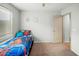 Bright bedroom featuring a fun Spiderman-themed bed and neutral walls at 44355 W Oster Dr, Maricopa, AZ 85138