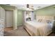 Bedroom featuring a window, ceiling fan, and an attached bathroom and dresser at 44355 W Oster Dr, Maricopa, AZ 85138