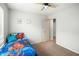 Bedroom with light carpet, a ceiling fan, and a twin size bed at 44355 W Oster Dr, Maricopa, AZ 85138