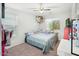 Cozy bedroom with a ceiling fan and a bright window with blinds at 44355 W Oster Dr, Maricopa, AZ 85138