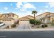 Charming single-Gathering home with a well-manicured front yard, a two-car garage, and a desert landscape at 44355 W Oster Dr, Maricopa, AZ 85138