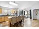 Modern kitchen with stainless steel appliances, center island, and adjacent dining area for entertaining at 44355 W Oster Dr, Maricopa, AZ 85138