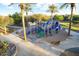 Aerial view of a colorful playground with climbing structures and slides, creating a fun area for  at 44355 W Oster Dr, Maricopa, AZ 85138