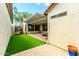 A lush backyard featuring artificial grass, trampoline, and covered patio at 4495 E Woodside Way, Gilbert, AZ 85297