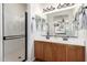 Modern bathroom with a double sink vanity, modern lighting and glass-enclosed shower at 4495 E Woodside Way, Gilbert, AZ 85297