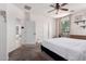 Bright bedroom with neutral carpet, ceiling fan, and a window for natural light at 4495 E Woodside Way, Gilbert, AZ 85297