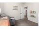 Comfortable bedroom with gray chair, book shelves and plenty of natural light at 4495 E Woodside Way, Gilbert, AZ 85297
