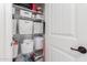 Organized closet with white wire shelves, white baskets and neutral carpet at 4495 E Woodside Way, Gilbert, AZ 85297
