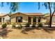 Charming single-story home with a well-maintained front yard and desert landscaping at 4495 E Woodside Way, Gilbert, AZ 85297